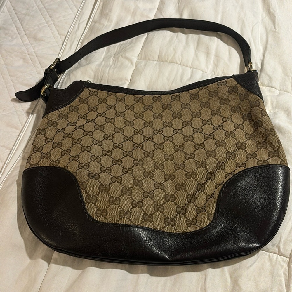 Gucci monogram Charlotte. Dark brown leather trim.  Excellent condition.